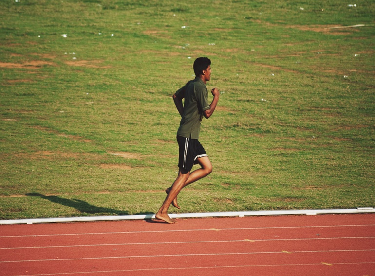 Man Running Barefoot 