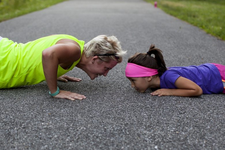 Mother and daughter do pushup
