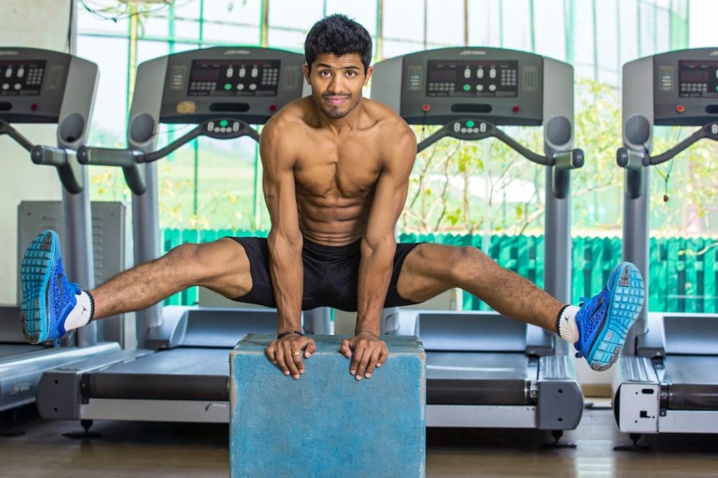 Man shows off his well-built body from routine treadmill workouts