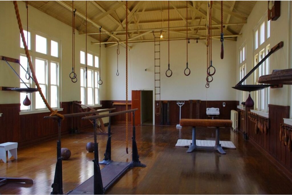 a gym with a series of hanging still rings